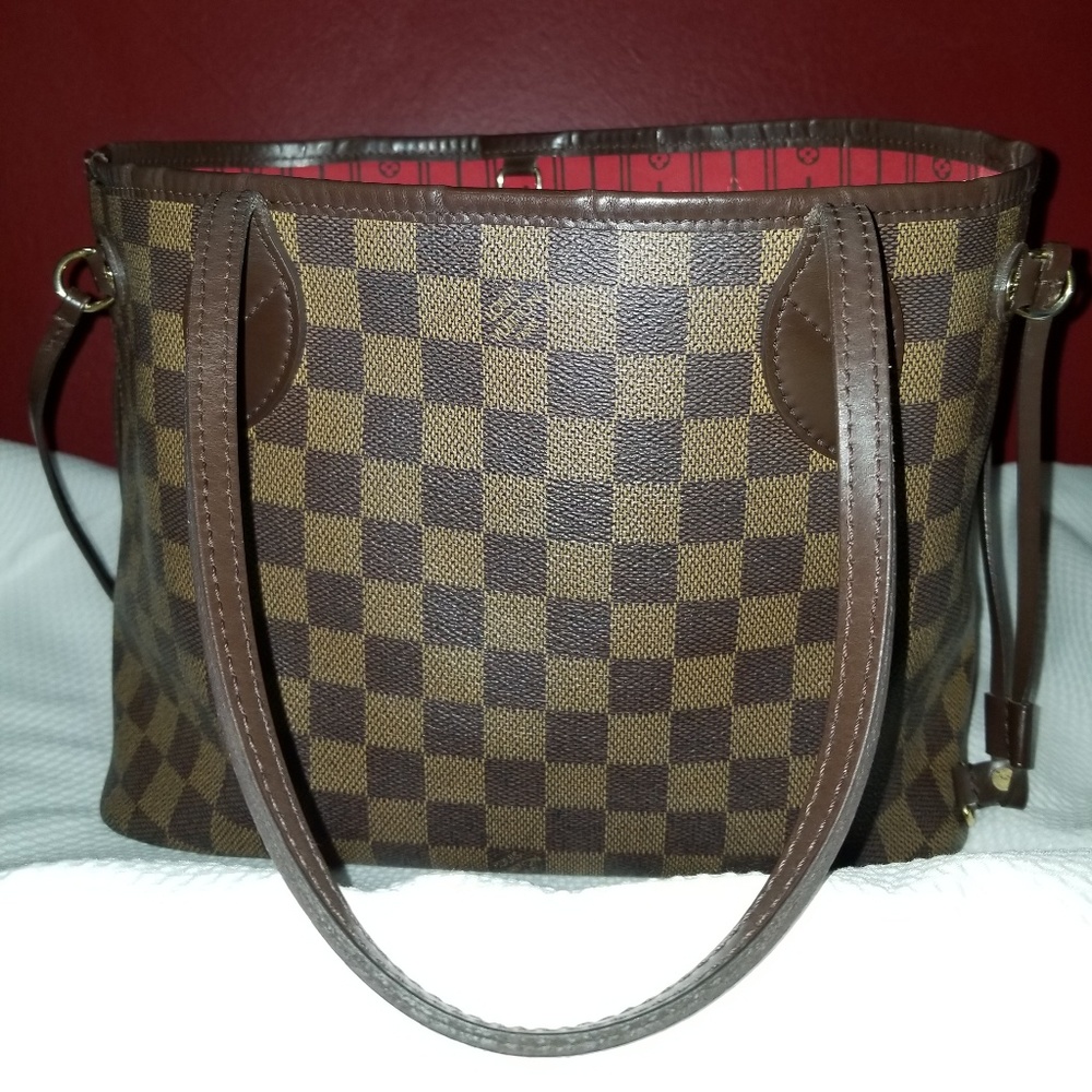 Louis Vuitton Neverfull PM tote.